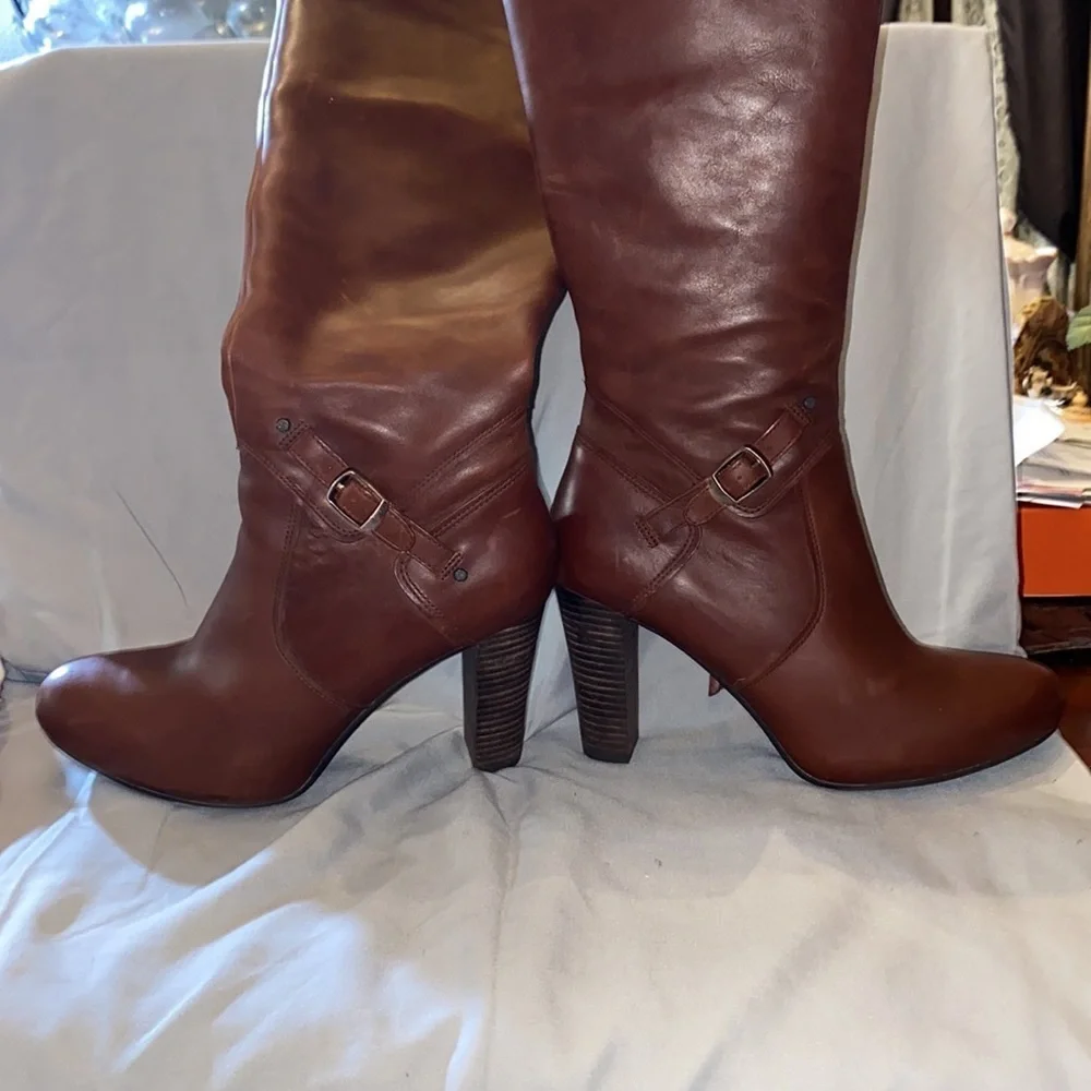 Never worn UGG leather knee high 4” heel with 1/2” platform